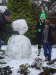 Dad lifts the head on under careful instruction