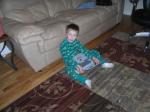 Trey playing with little little laptop.