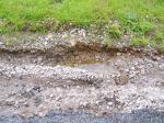 New gully washed out from the running water along the driveway