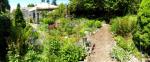 path next to garden on right and house to left