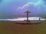 Cement umbrella built just a few years ago, now is eroded by the weather.